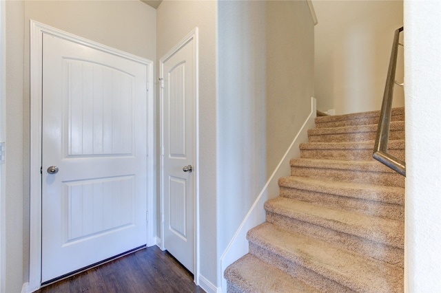 staircase featuring hardwood / wood-style flooring