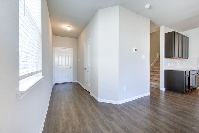 foyer entrance with dark hardwood / wood-style flooring