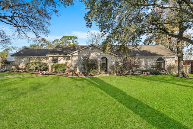 ranch-style home with a front yard