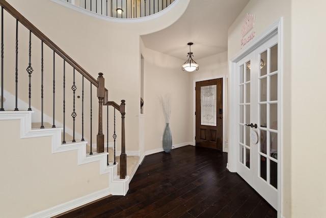 entryway featuring dark hardwood / wood-style flooring and french doors