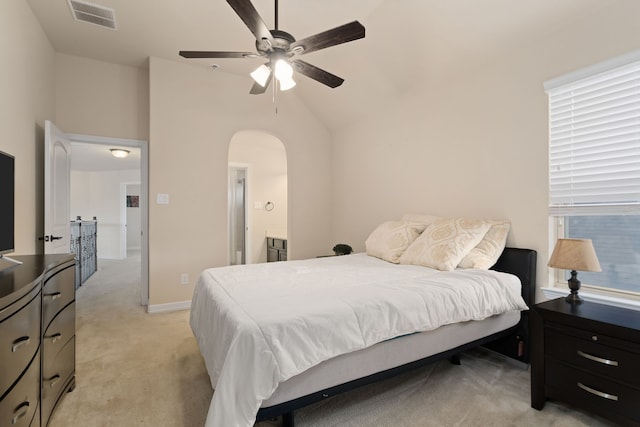 carpeted bedroom featuring connected bathroom, ceiling fan, and lofted ceiling