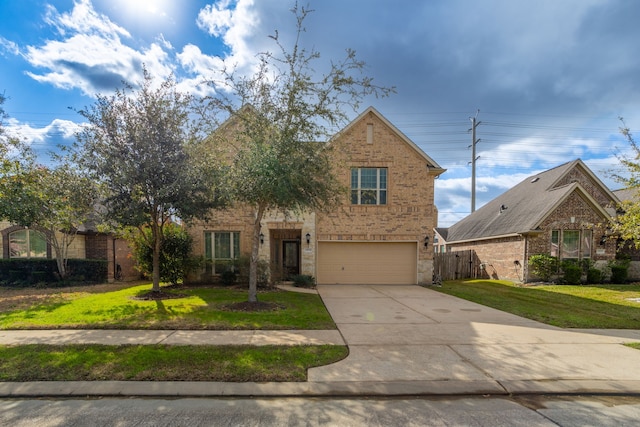 view of front of home with a front lawn and a garage