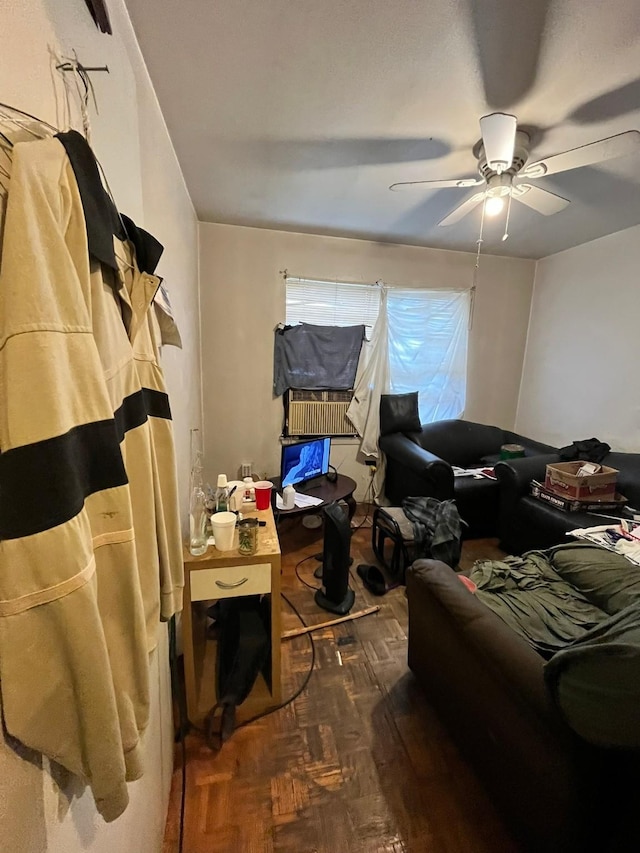 bedroom with ceiling fan and dark parquet floors