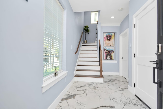 staircase with plenty of natural light