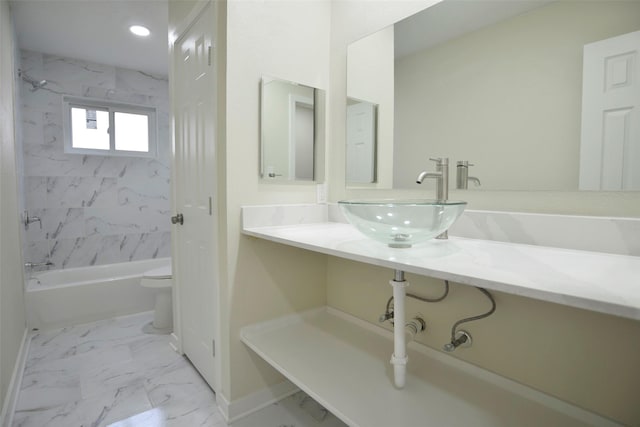 full bathroom featuring vanity, toilet, and tiled shower / bath