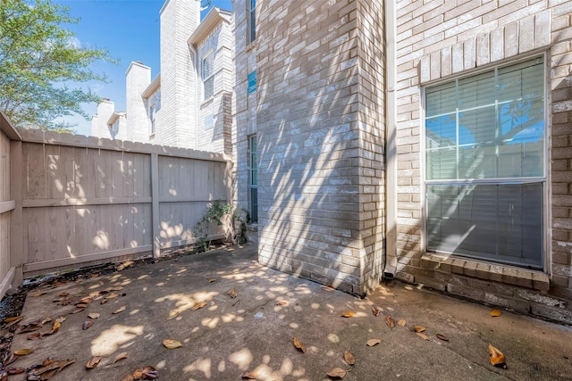 view of property exterior with a patio