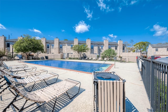 view of swimming pool with a patio