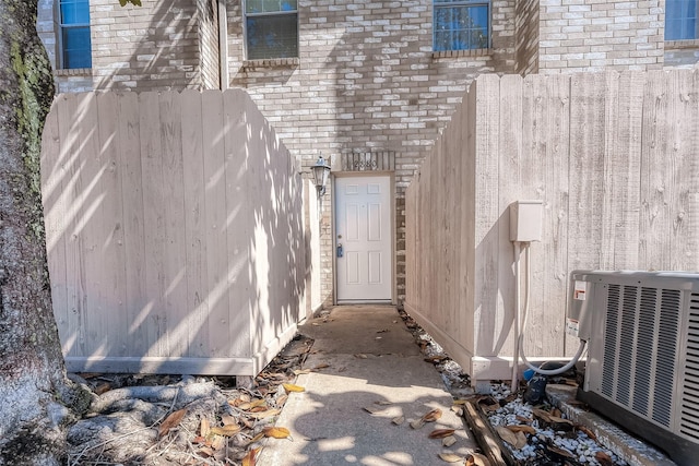 doorway to property with central air condition unit