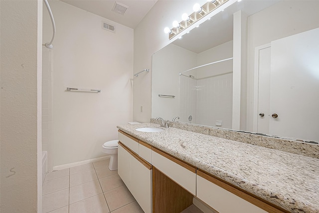 full bathroom with tile patterned floors, vanity, toilet, and shower / bath combination