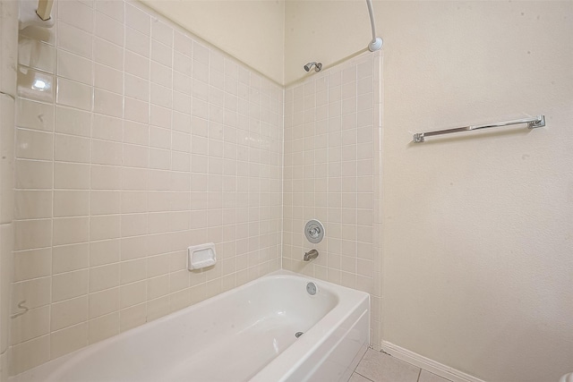 bathroom with tile patterned floors and tiled shower / bath