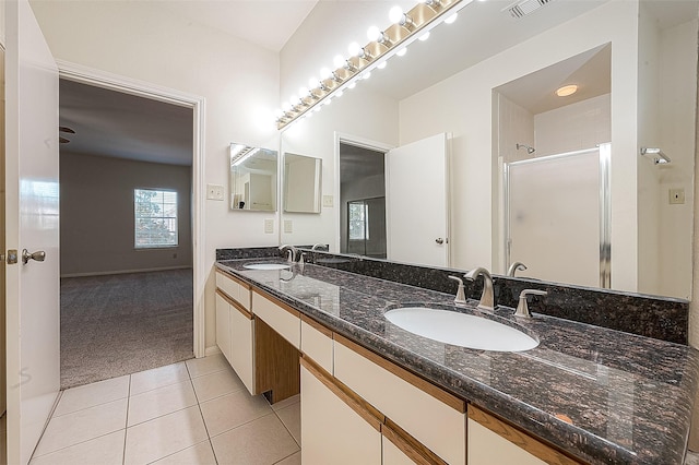 bathroom with vanity, tile patterned floors, and an enclosed shower