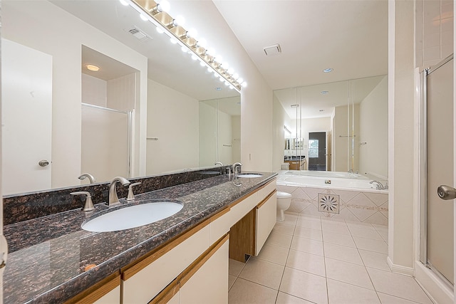 full bathroom featuring tile patterned floors, separate shower and tub, and toilet