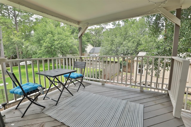 wooden terrace with a yard