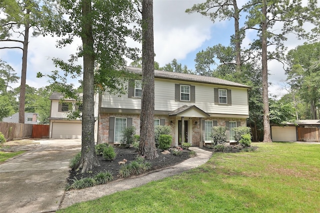 view of front of property with a garage and a front lawn