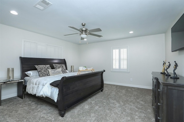 bedroom with ceiling fan and dark carpet