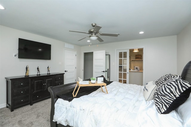 bedroom featuring light colored carpet and ceiling fan