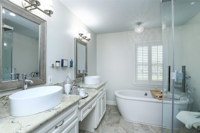 bathroom with vanity and a bathing tub