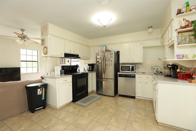 kitchen featuring sink, stainless steel appliances, and white cabinets