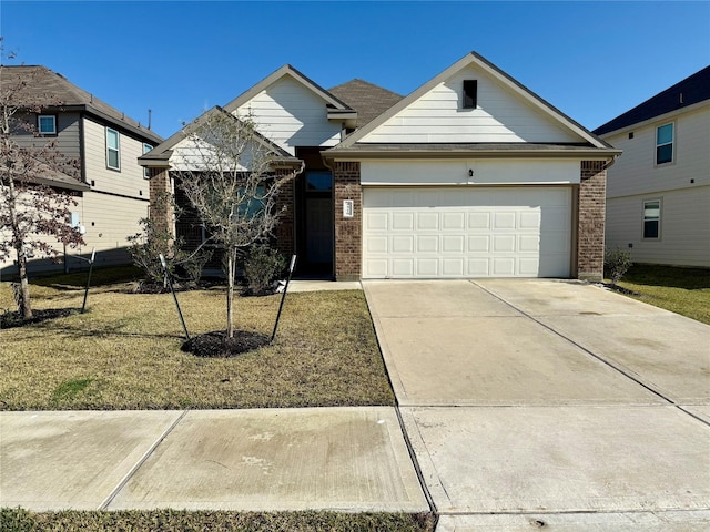 view of front facade with a front yard and a garage