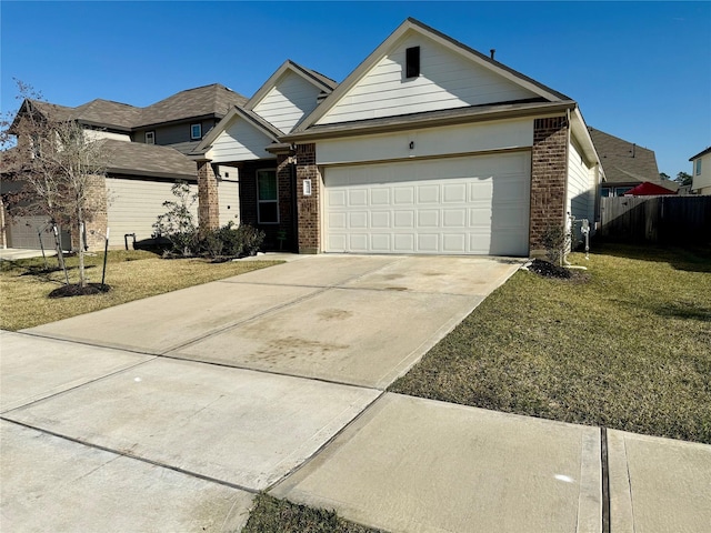 view of front of property featuring a garage and a front lawn