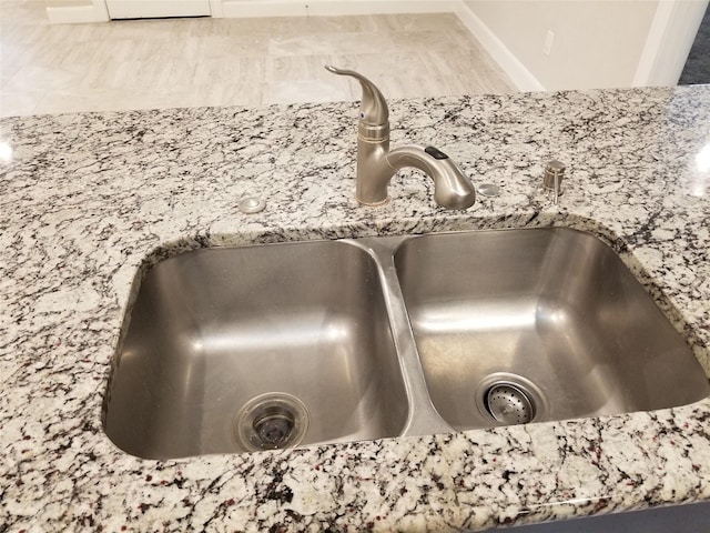 room details with stone counters and sink