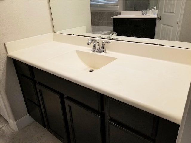 bathroom featuring tile patterned floors and vanity