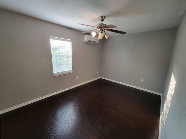 empty room featuring a wall mounted AC, ceiling fan, and hardwood / wood-style floors