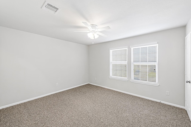 carpeted empty room with ceiling fan