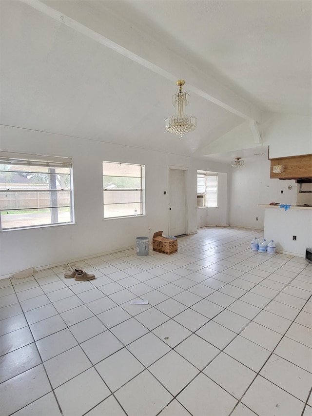 unfurnished living room with light tile patterned flooring, beam ceiling, a chandelier, and high vaulted ceiling