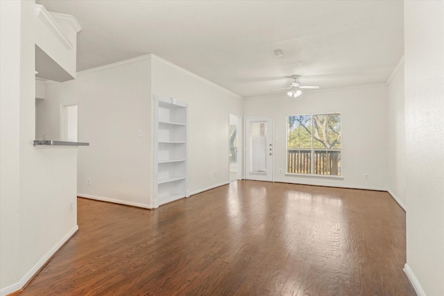 unfurnished living room with ceiling fan, dark hardwood / wood-style flooring, and crown molding