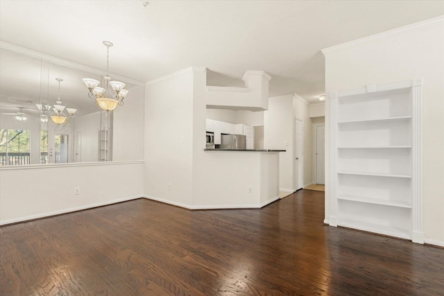 unfurnished living room with ceiling fan with notable chandelier, dark hardwood / wood-style floors, and ornamental molding