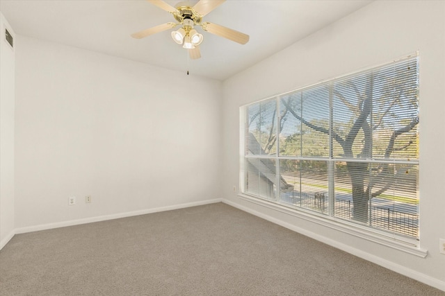 spare room with ceiling fan and carpet floors