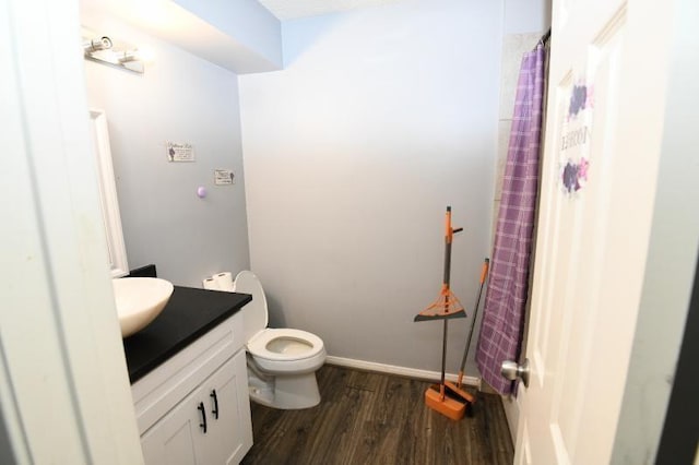 bathroom featuring hardwood / wood-style floors, vanity, and toilet