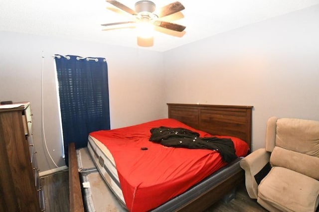 bedroom featuring ceiling fan and wood-type flooring