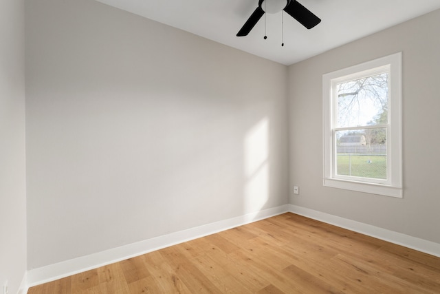 spare room with wood-type flooring and ceiling fan