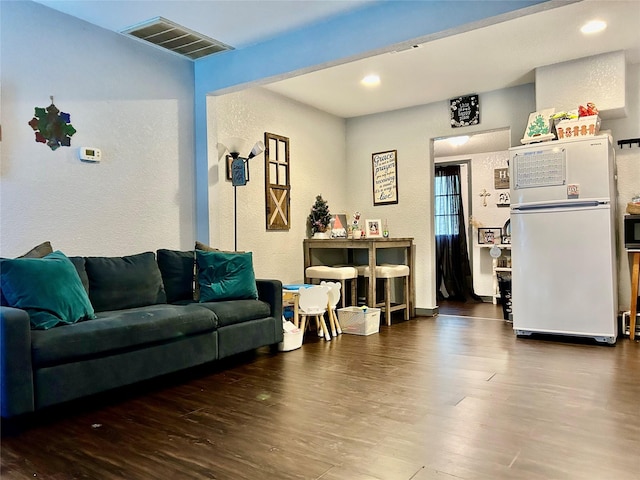 living room with dark wood-type flooring