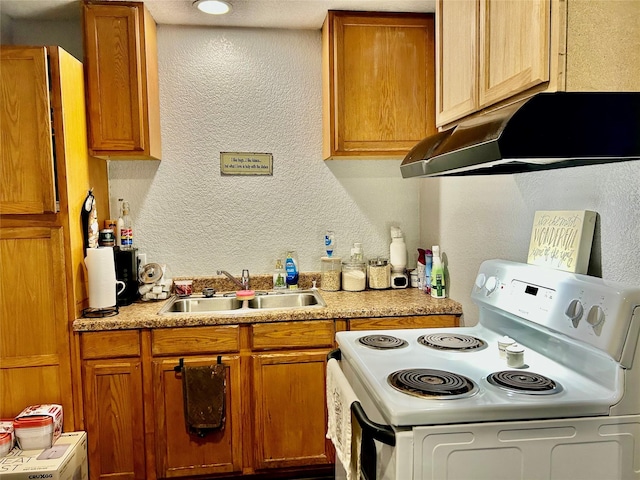 kitchen featuring white range with electric stovetop and sink