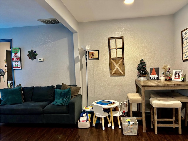 living room featuring dark wood-type flooring