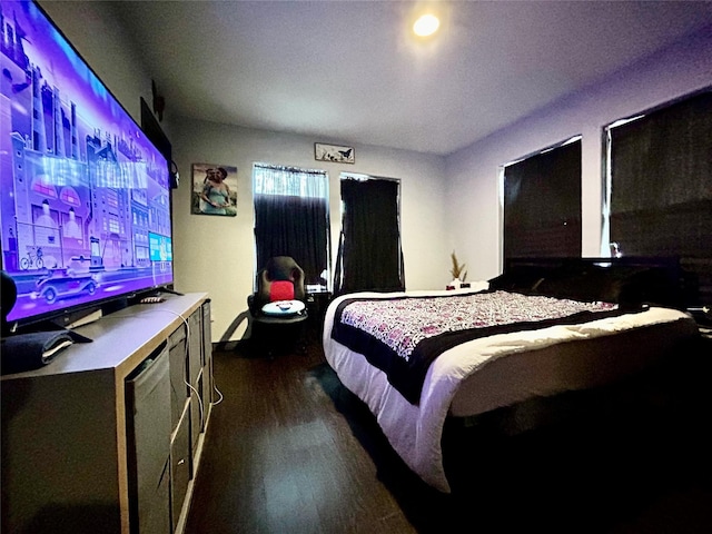 bedroom featuring dark wood-type flooring