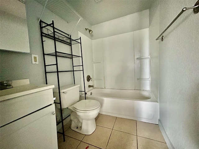 bathroom featuring toilet, tub / shower combination, vanity, baseboards, and tile patterned floors