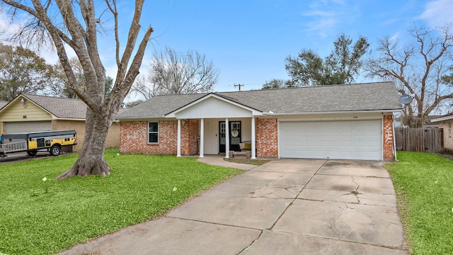 single story home featuring a garage and a front yard