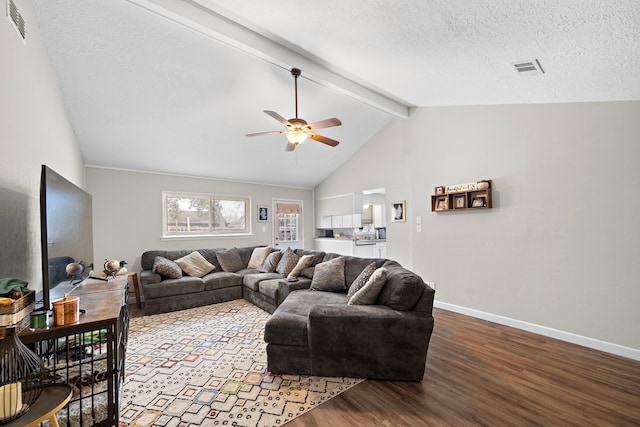 living room with ceiling fan, lofted ceiling with beams, light hardwood / wood-style floors, and a textured ceiling