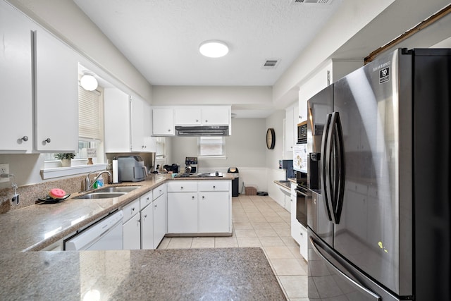 kitchen with stainless steel refrigerator with ice dispenser, white dishwasher, sink, and white cabinets