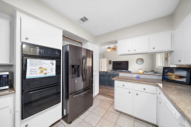 kitchen with white cabinetry, stainless steel appliances, ceiling fan, and light tile patterned flooring