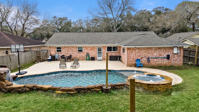 view of swimming pool with a yard and a patio area