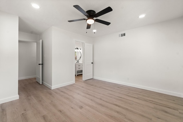 unfurnished bedroom featuring light wood-type flooring and ceiling fan