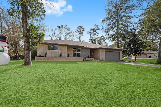 single story home featuring a front yard and a garage