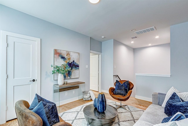 living room with light hardwood / wood-style flooring