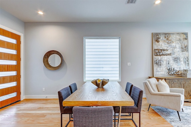 dining space featuring light wood-type flooring