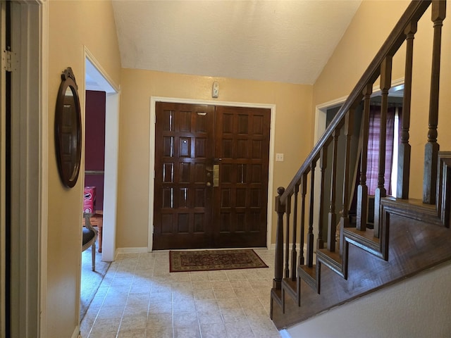 entryway with lofted ceiling